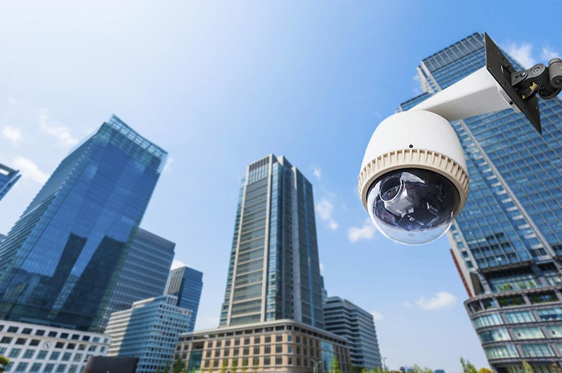 Honeywell Digital Video Manager - CCTV Camera or surveillance oeprating with building in background